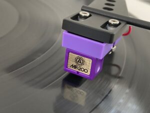 Nagaoka MP-200 phono cartridge mounted on turntable headshell